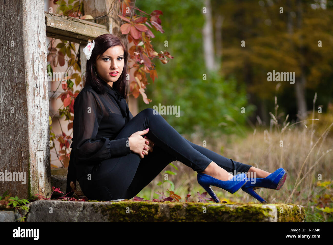 Girl sitting on stairs hi-res stock photography and images - Alamy