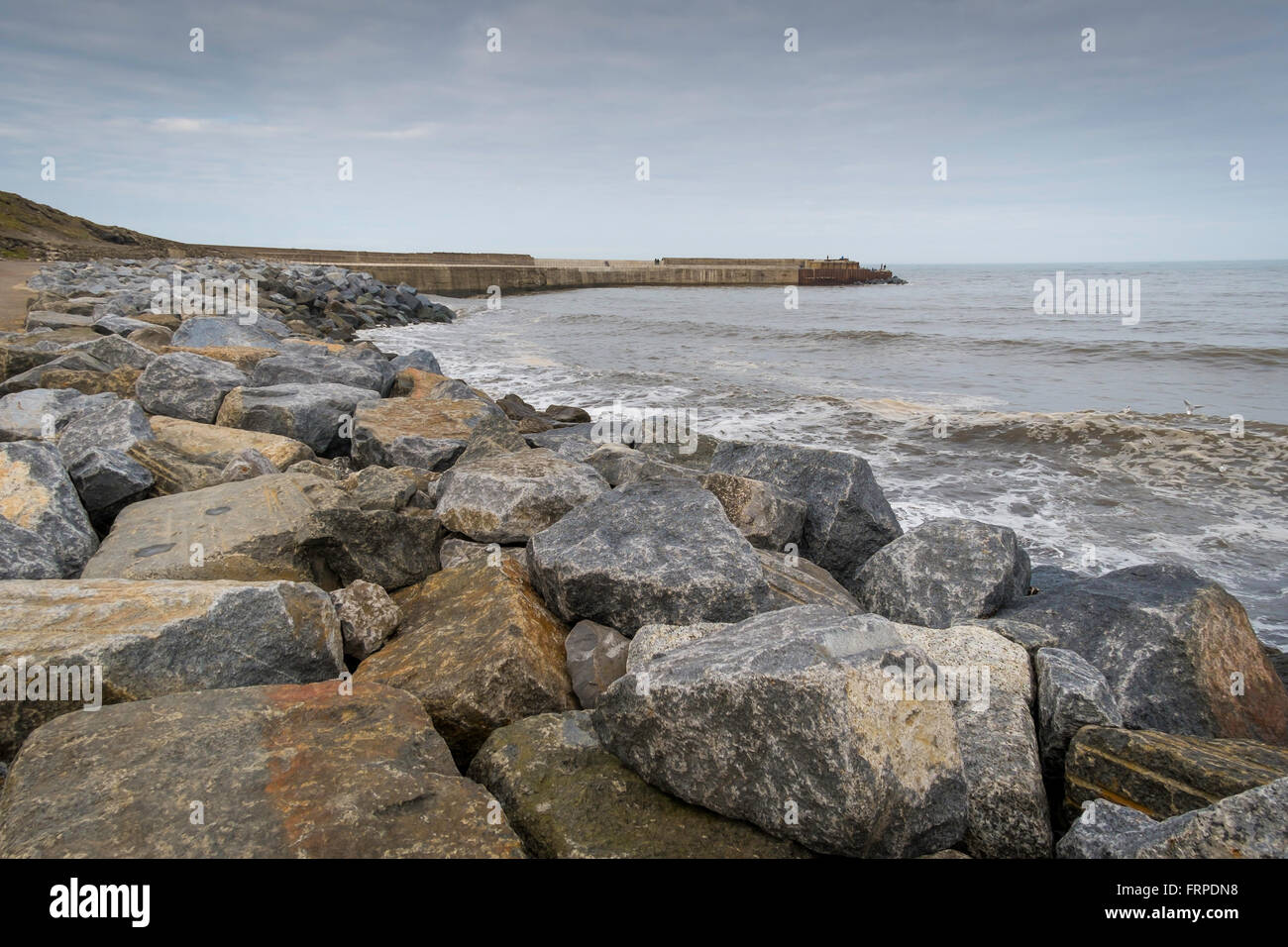Rock armour to prevent coastal erosion in Skinningrove Harbour Cleveland UK Stock Photo