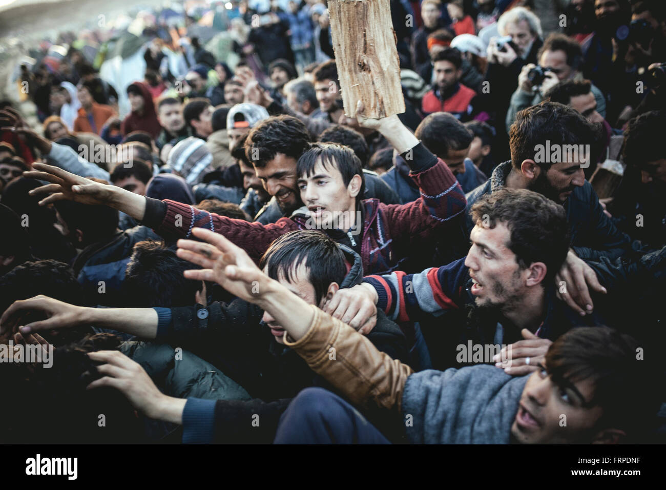 Idomeni refugee camp on the Greece Macedonia border, refugees waiting for the firewood delivery, Idomeni, Central Macedonia Stock Photo