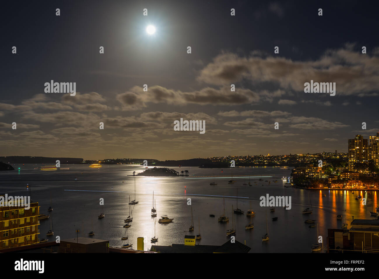 Sydney Harbour in the moonlight with water reflections - Long exposure Stock Photo