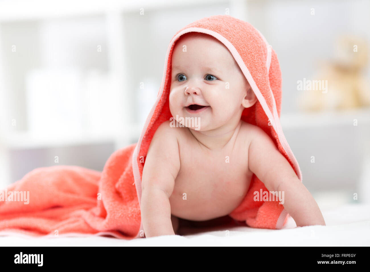 Smiling baby after shower or bath with towel on head Stock Photo Alamy