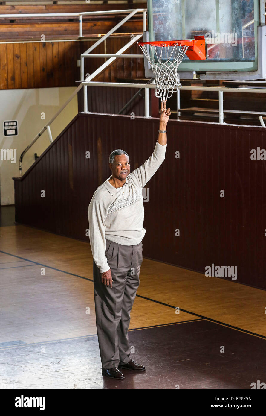 West Palm Beach, Florida, USA. 22nd Mar, 2016. Pembroke Burrows checks out the height of the net in the gym at the old Roosevelt High School Tuesday morning, March 22, 2016, where he played basketball. He wound playing in college and helping Jacksonville reach the 1970 NCAA final, where it lost to UCLA. He was later the third black Florida state trooper and later returned to West Palm Beach to be a spokesman for the troopers. He still lives here. © Lannis Waters/The Palm Beach Post/ZUMA Wire/Alamy Live News Stock Photo