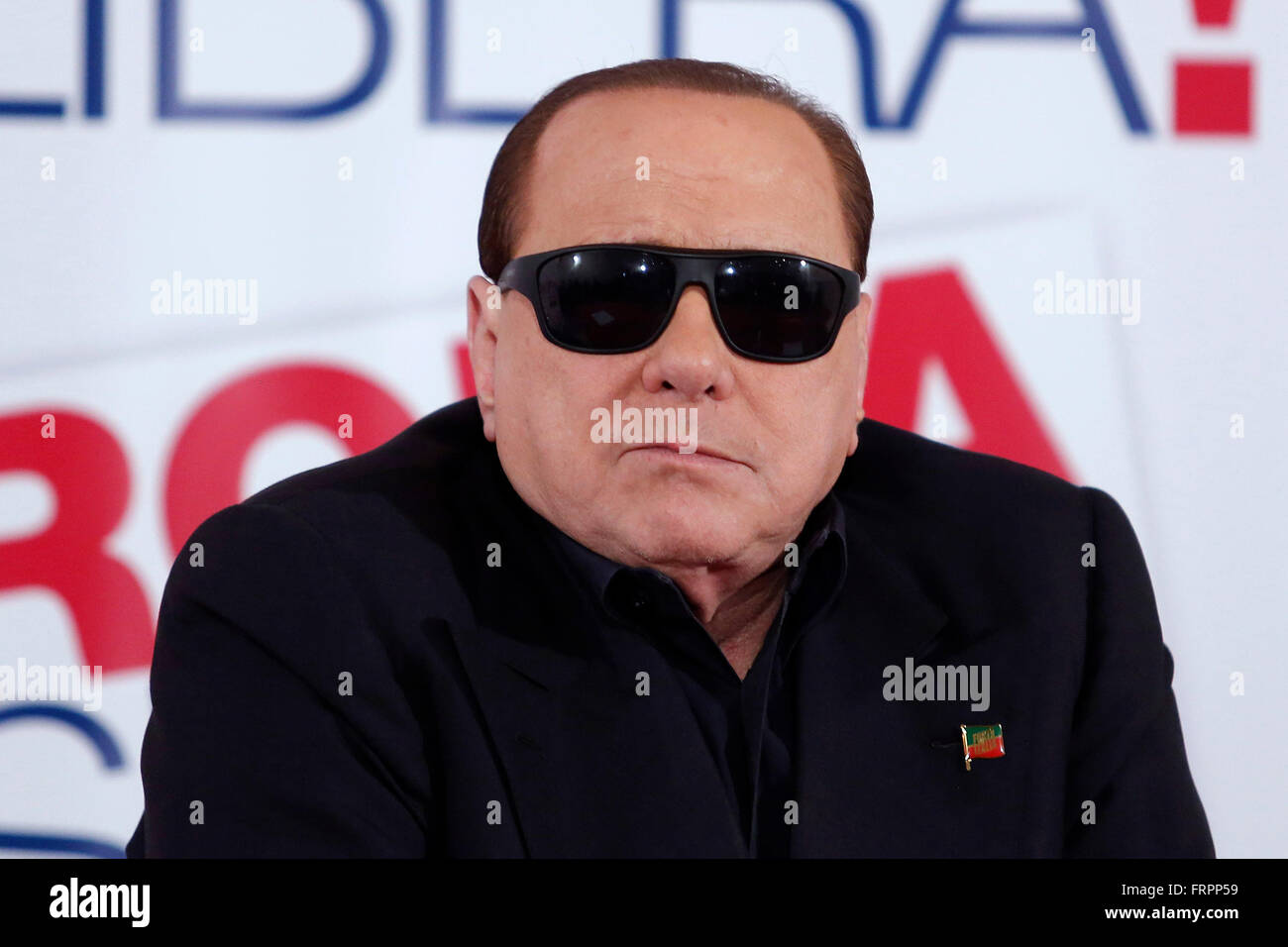 Rome, Italy. 23rd March, 2016. Silvio Berlusconi wearing sunglasses due to  an operation Rome 23rd March 2016. The ex italian Premier visits the  headquarter of Forza Italia for the next elections in