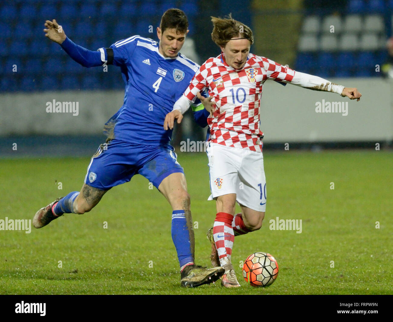 Osijek, Croatia. 23rd Mar, 2016. Nikola Kalinic (R) of Croatia vies for the ball with Nir Bitton of Israel during their friendly match in Osijek, Croatia, March 23, 2016. Croatia won 2-0. Credit:  Miso Lisanin/Xinhua/Alamy Live News Stock Photo