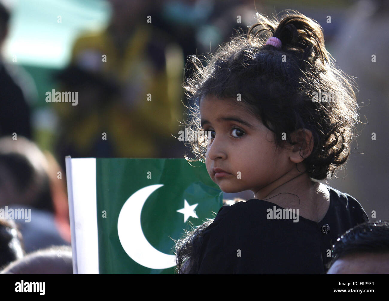 Lahore, Pakistan. 23rd Mar, 2016. Pakistani people celebrating Pakistan Day in Lahore. Pakistan celebrates its National Day to commemorate the adoption of the 1940 resolution (also known as the Pakistan or Lahore resolution) demanding a separate state for the Muslims of British-ruled India. Credit:  Rana Sajid Hussain/Pacific Press/Alamy Live News Stock Photo