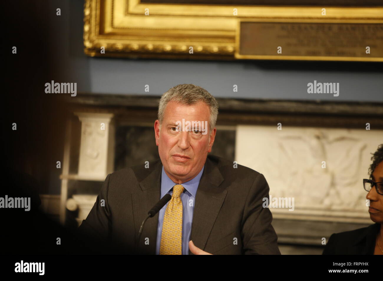 New York City, United States. 23rd Mar, 2016. Mayor de Blasio listens to comments from manager. Mayor de Blasio joined with members of his administration, the city council & healthcare professionals to discuss the need for funding for housing on behalf of victims of domestic violence Credit:  Andy Katz/Pacific Press/Alamy Live News Stock Photo