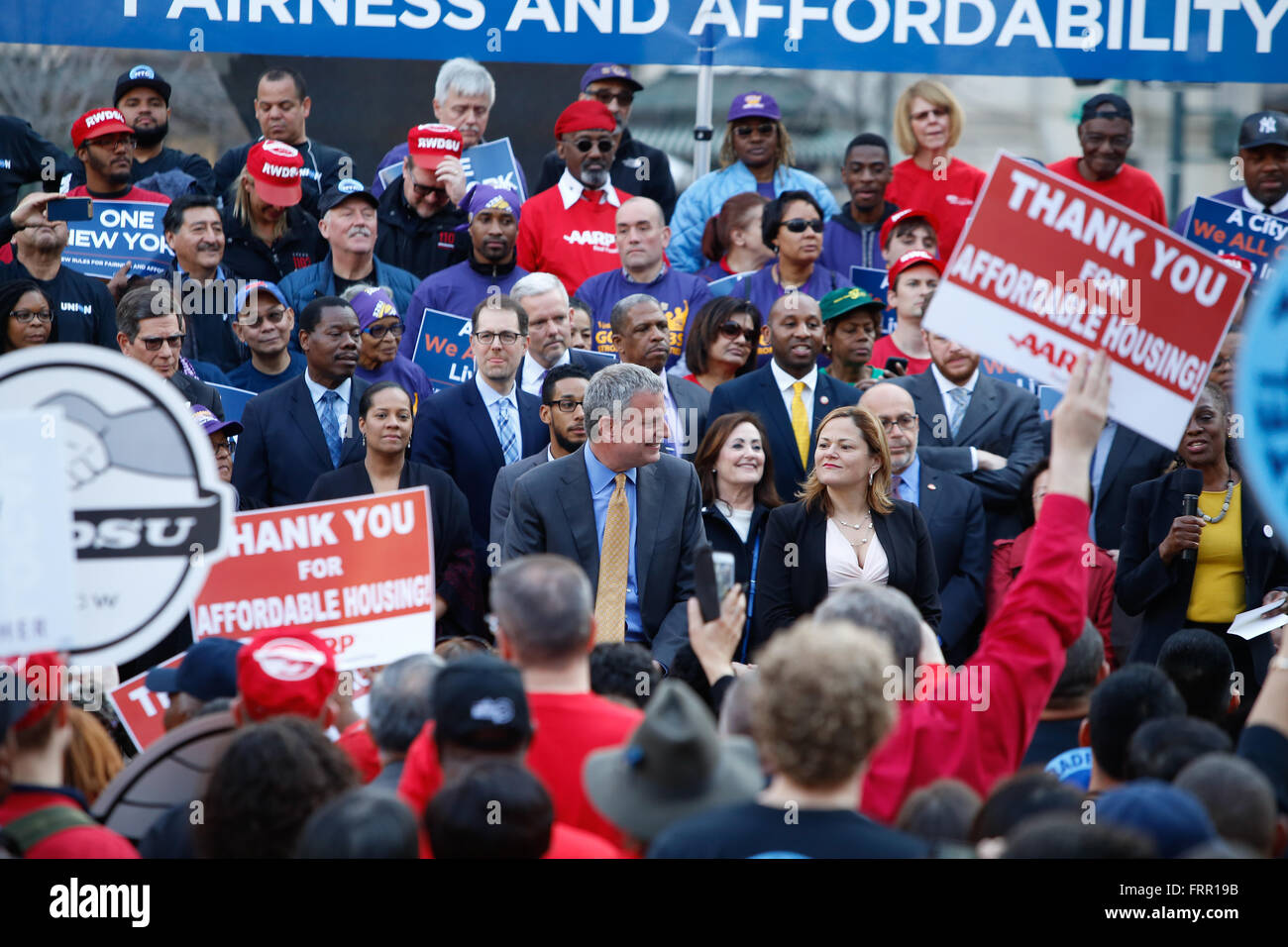 New York City, USA, 23 March 2016: Mayor Bill de Blasio & council speaker Melissa Mark-Viverito accept applause during a Foley Square rally in celebration of NYC's new mandatory inclusionary zoning law. Credit:  Andrew Katz/Alamy Live News Stock Photo