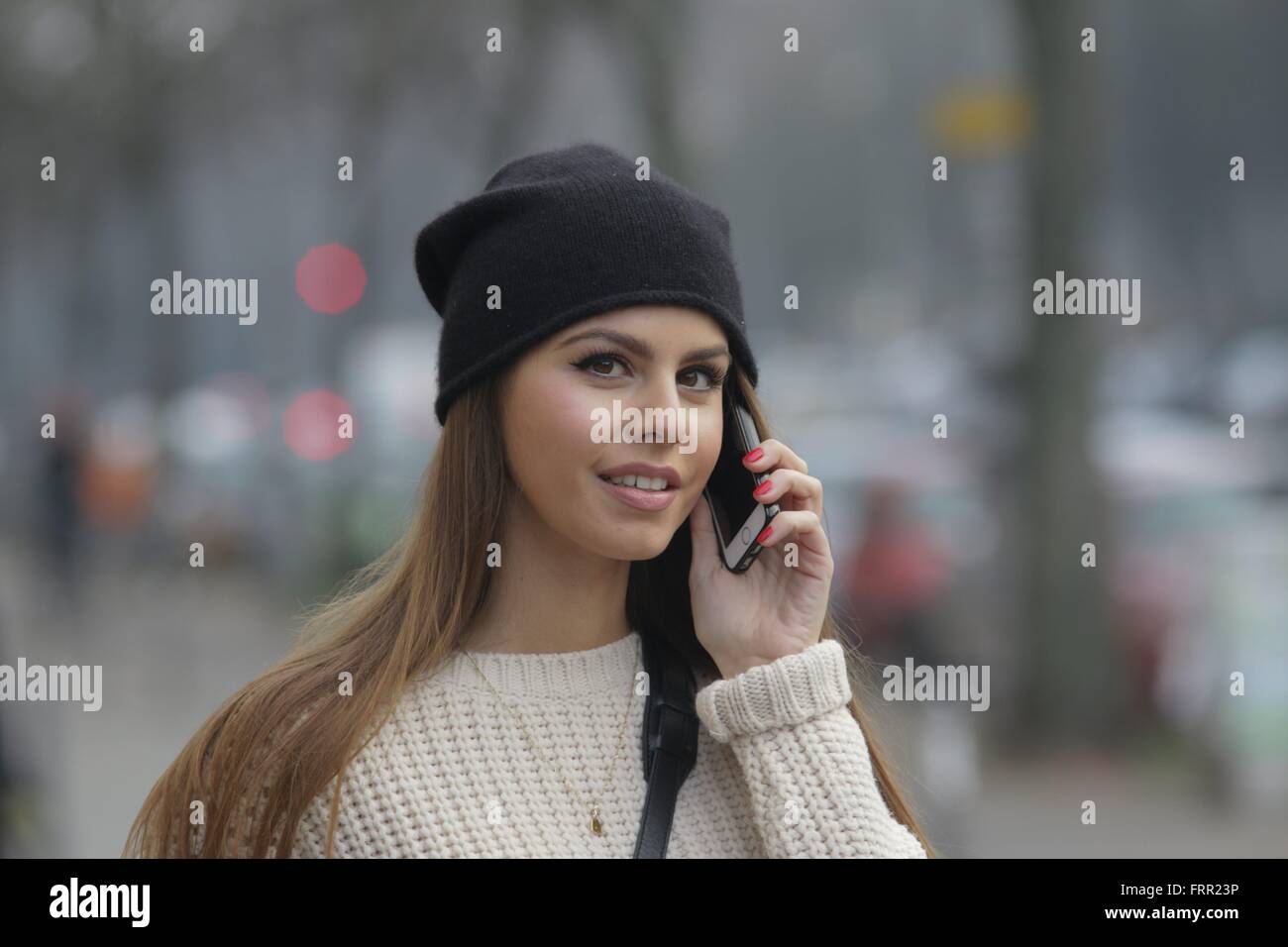 Young woman runs inattentively and without looking with mobile phone on the sidewalk. 03.12.2015 Stock Photo