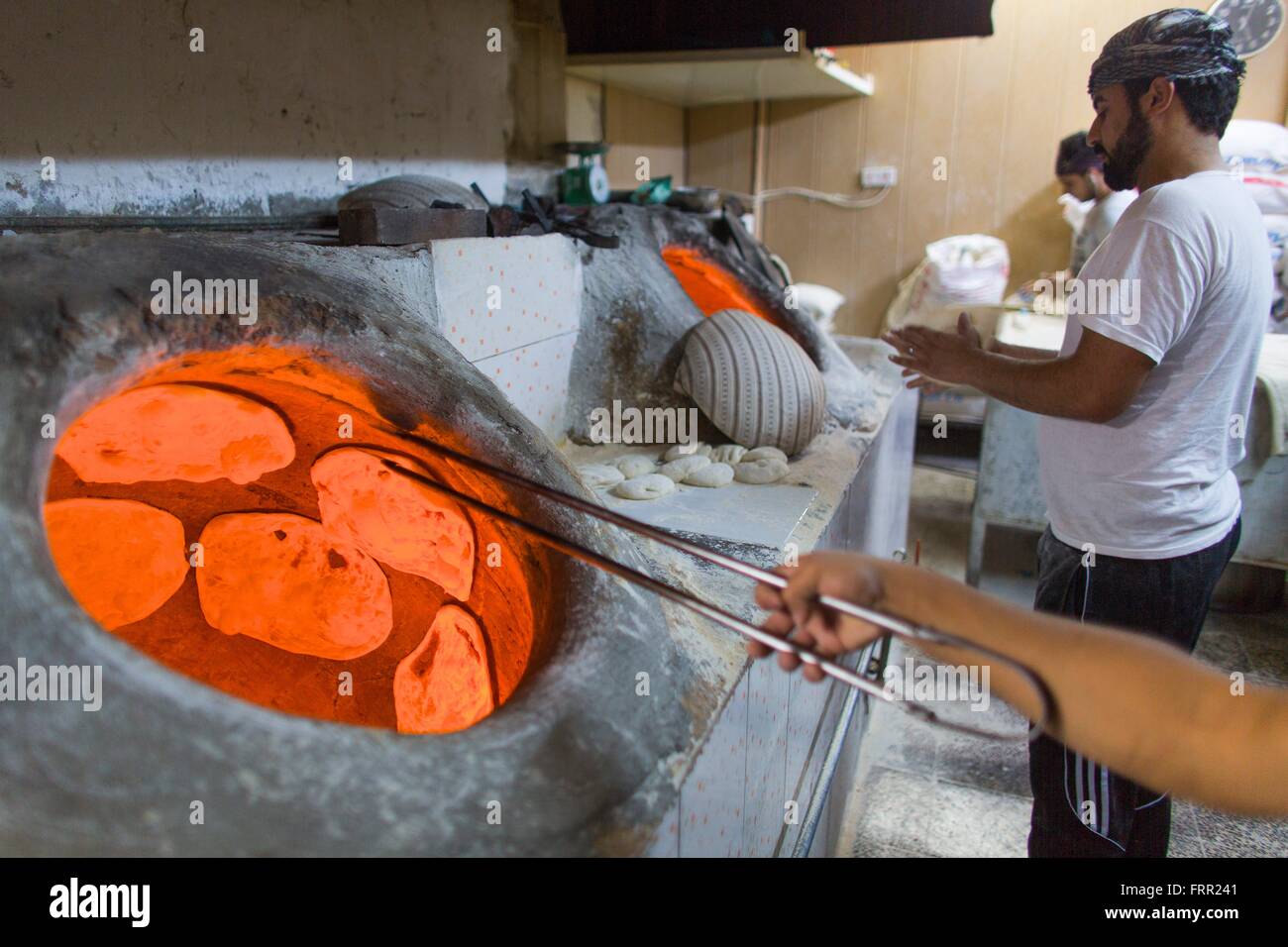 bread baked in a clay oven in Northern Iraq Stock Photo - Alamy