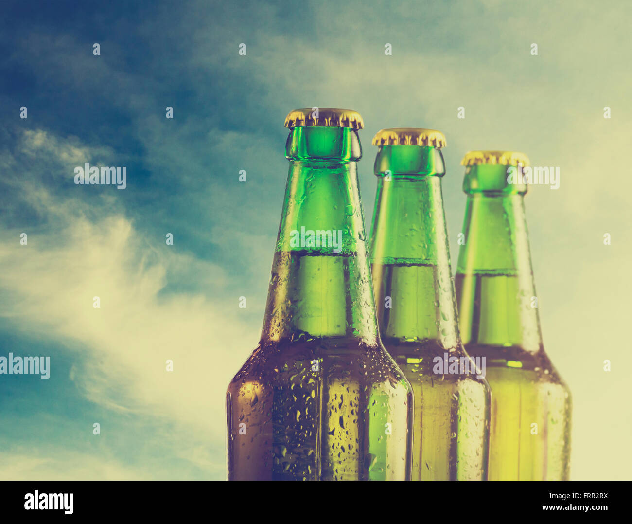 Beer bottles on the beach. Retro filter Stock Photo Alamy