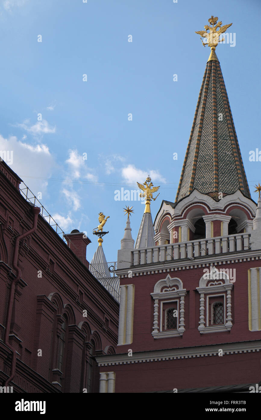 Golden lion and two headed eagle symbols on Nikolskaya Tower, Kremlin Walls, Moscow, Russia. Stock Photo