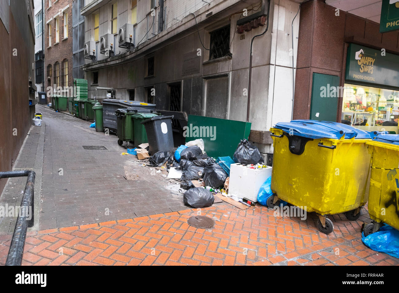 Rubbish bins and litter in a side street in Birmingham city centre