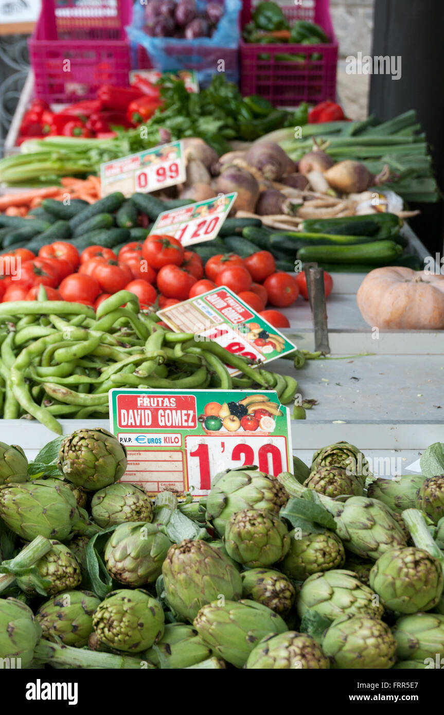 Fresh vegetable produce for sale on a market stall Stock Photo