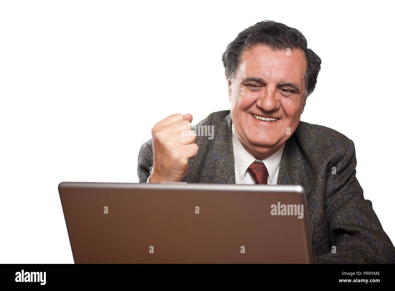 Portrait of a happy business man with a laptop isolated on white background gesturing Stock Photo