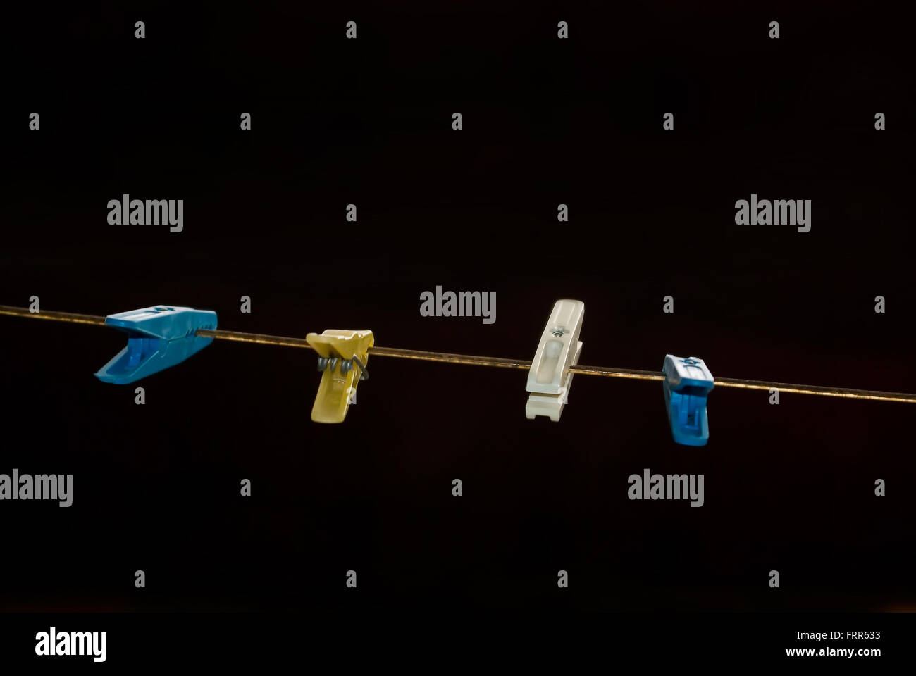 clothes peg lined on a wire Stock Photo Alamy