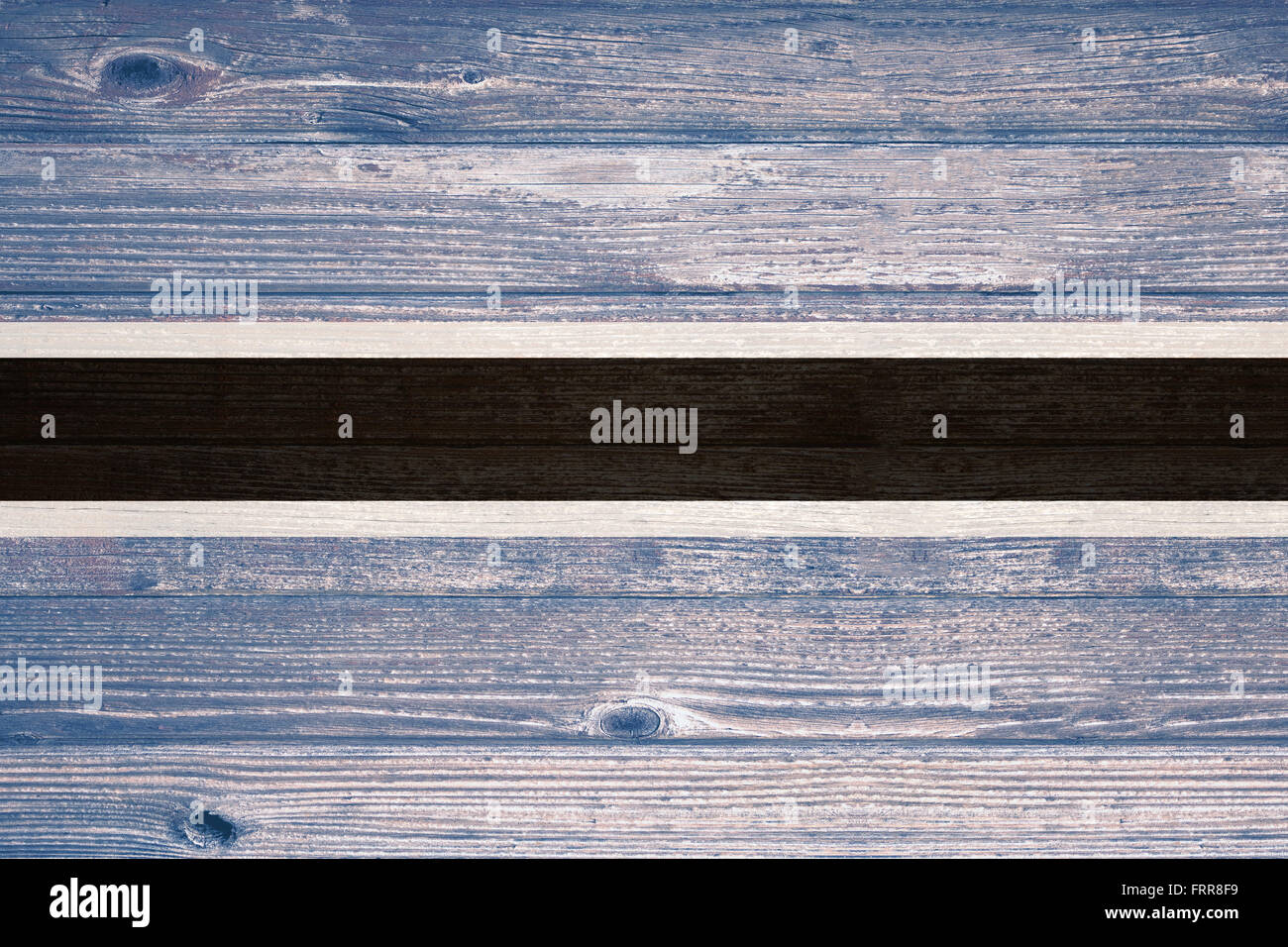 Botswana Flag painted on old wood plank background Stock Photo - Alamy