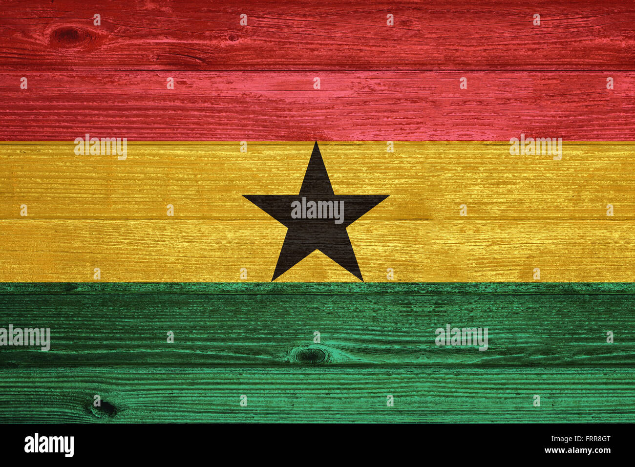 Ghana Flag painted on old wood plank background Stock Photo - Alamy