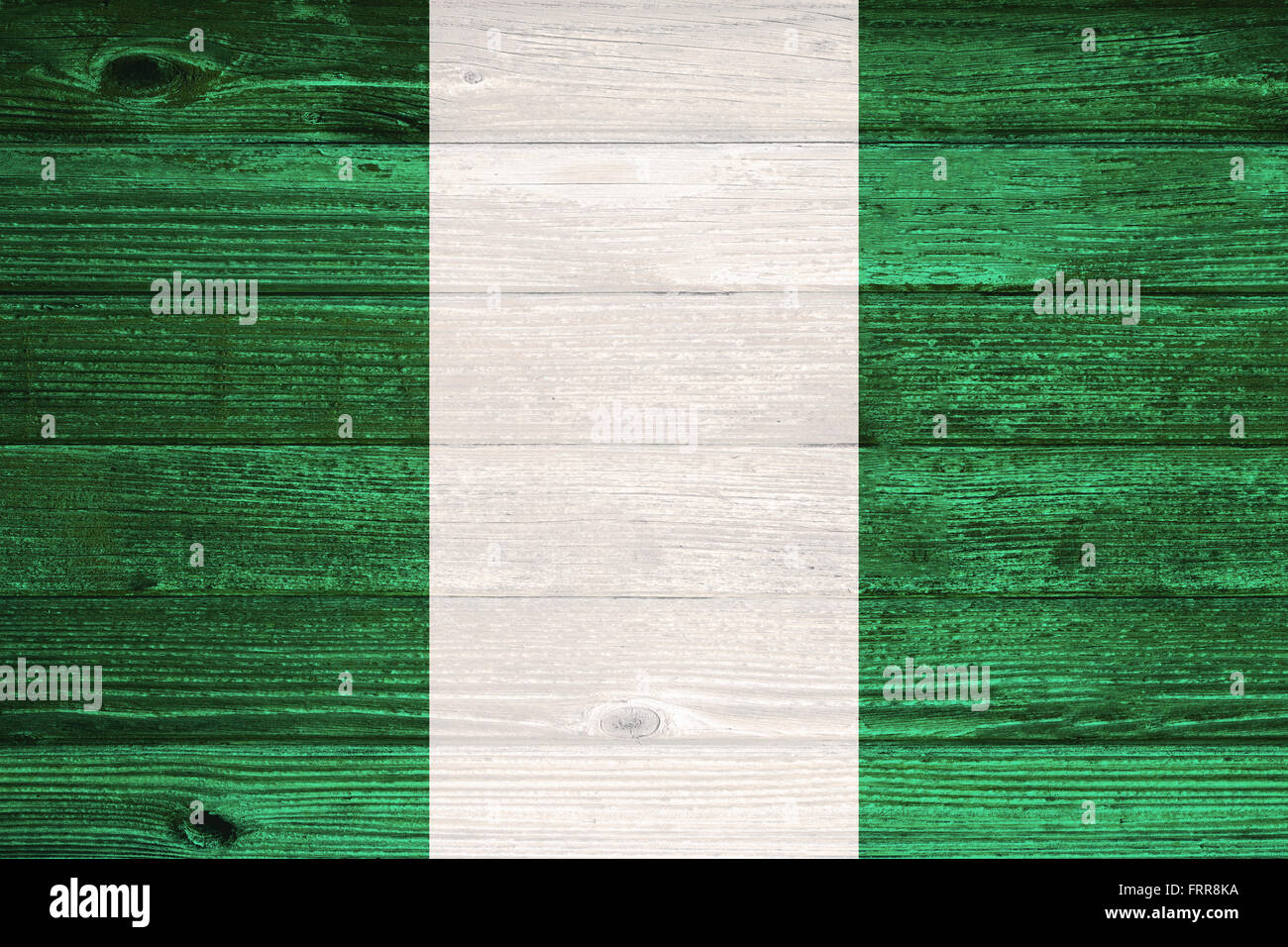 Nigeria Flag painted on old wood plank background Stock Photo - Alamy