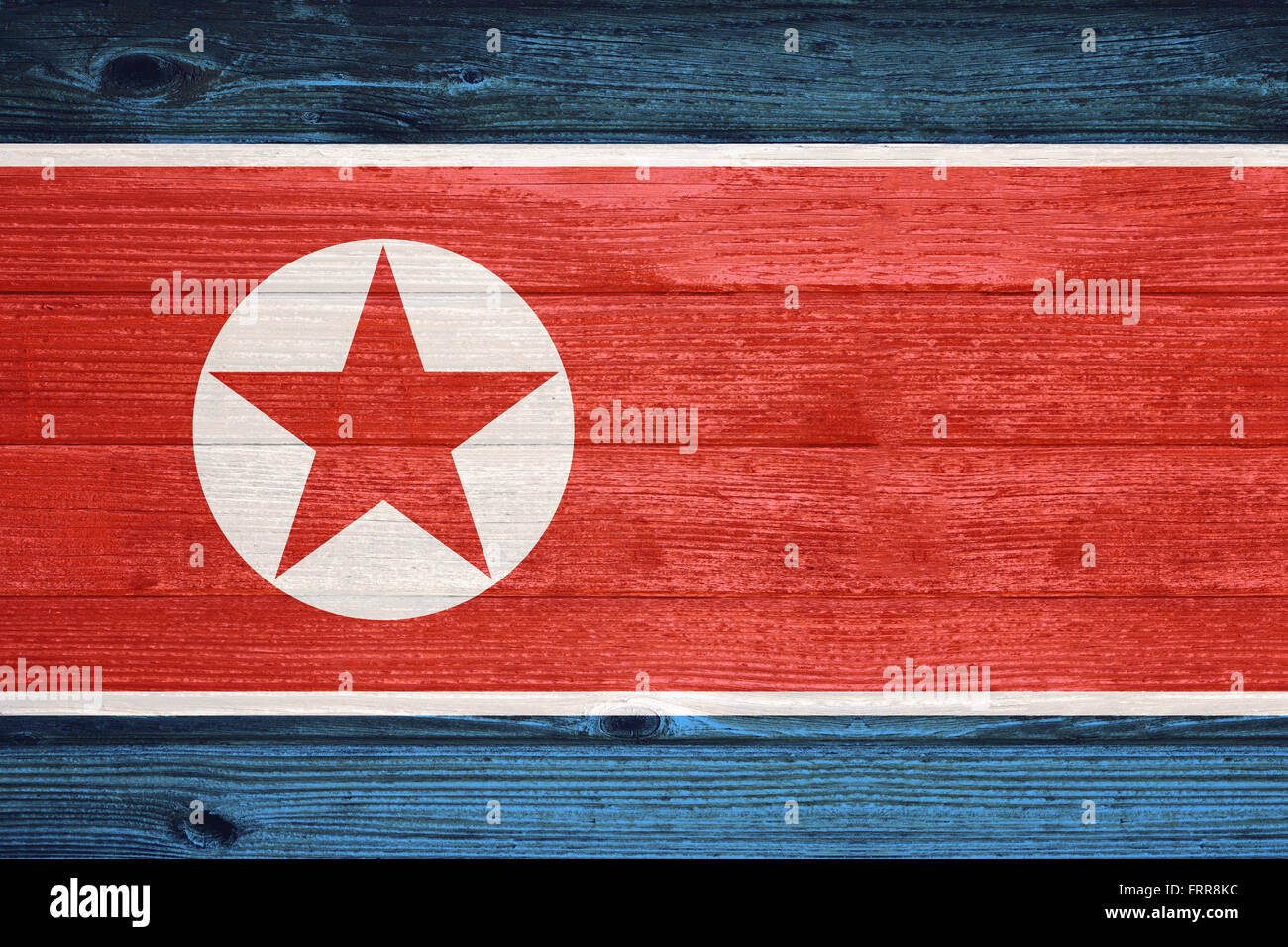 North Korea Flag painted on old wood plank background Stock Photo