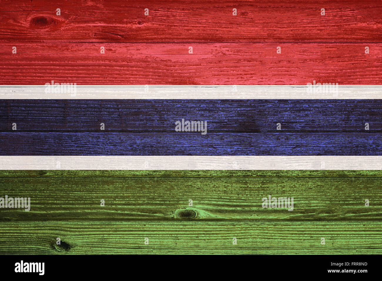 Gambia Flag painted on old wood plank background Stock Photo - Alamy