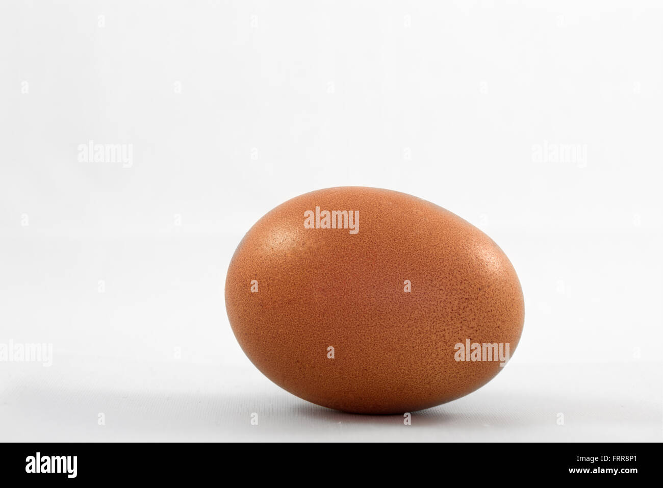A free range egg with deep brown coloured shell Stock Photo