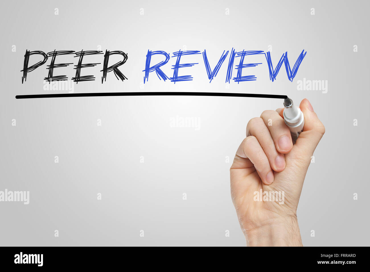 Peer review written on a white board Stock Photo