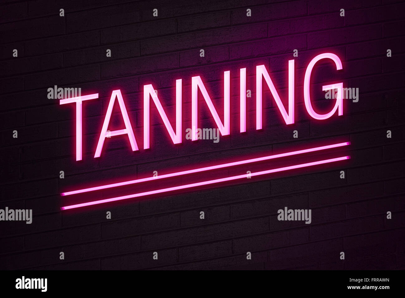 Pink neon sign with tanning text on wall Stock Photo