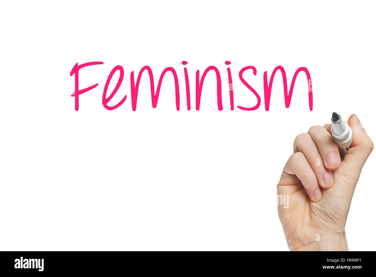 Hand writing feminism on a white board Stock Photo