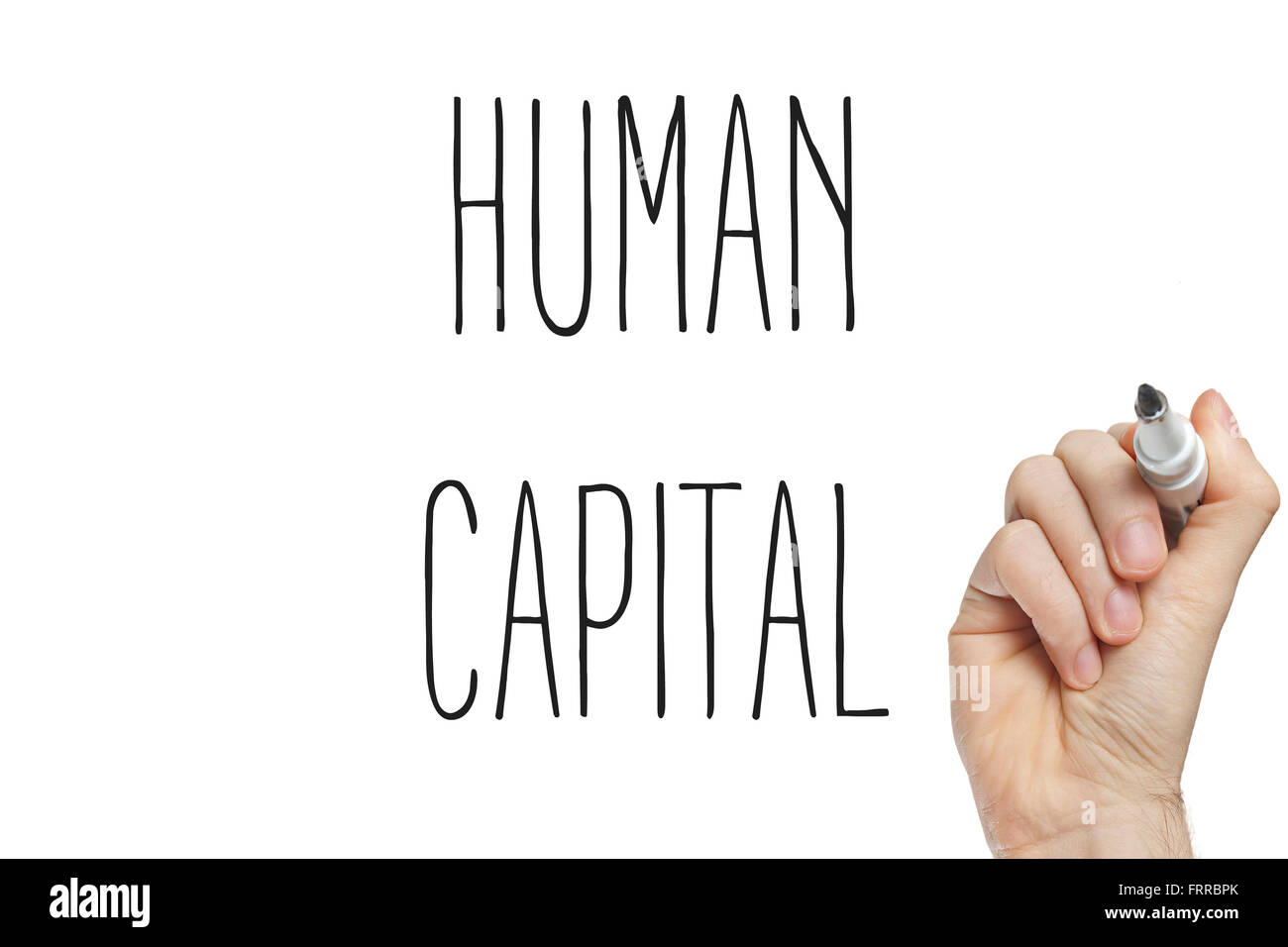 Hand writing human capital on a white board Stock Photo