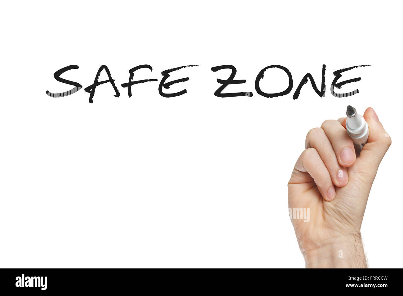 Hand writing safe zone on a white board Stock Photo