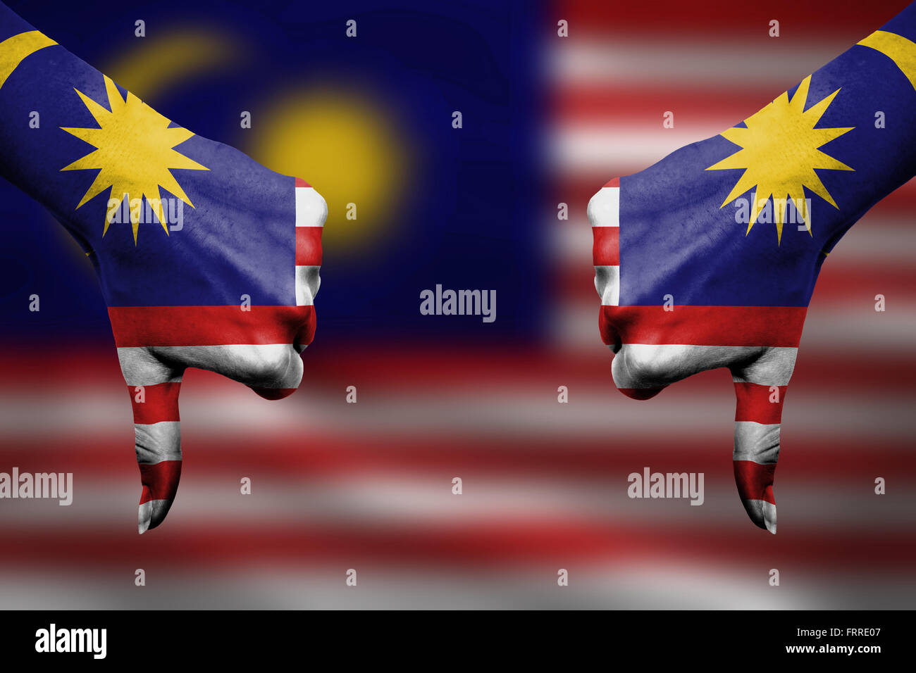 failure of Malaysia - hands gesturing thumbs down in front of flag ...