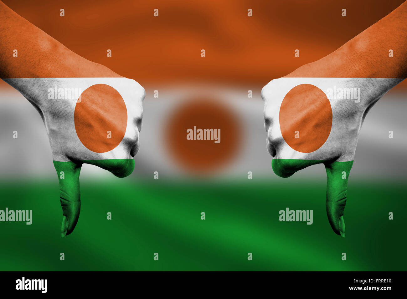 failure of Niger - hands gesturing thumbs down in front of flag Stock ...