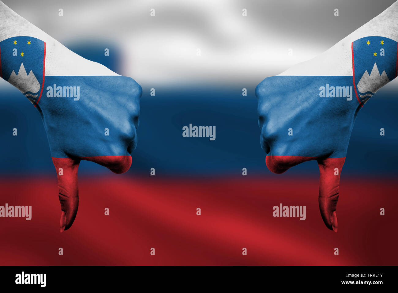 failure of Slovenia - hands gesturing thumbs down in front of flag ...
