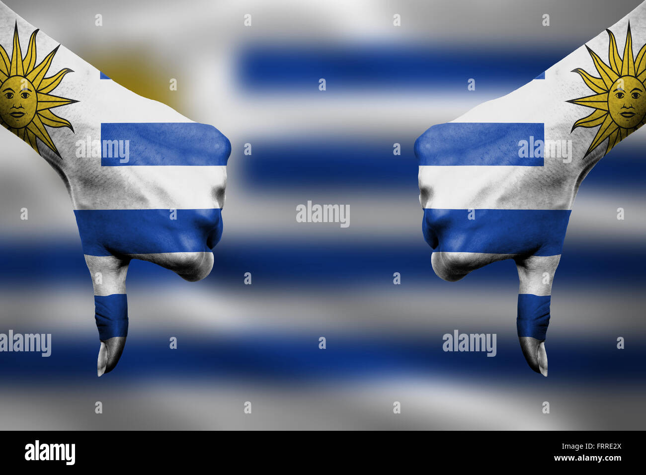 failure of Uruguay - hands gesturing thumbs down in front of flag Stock ...