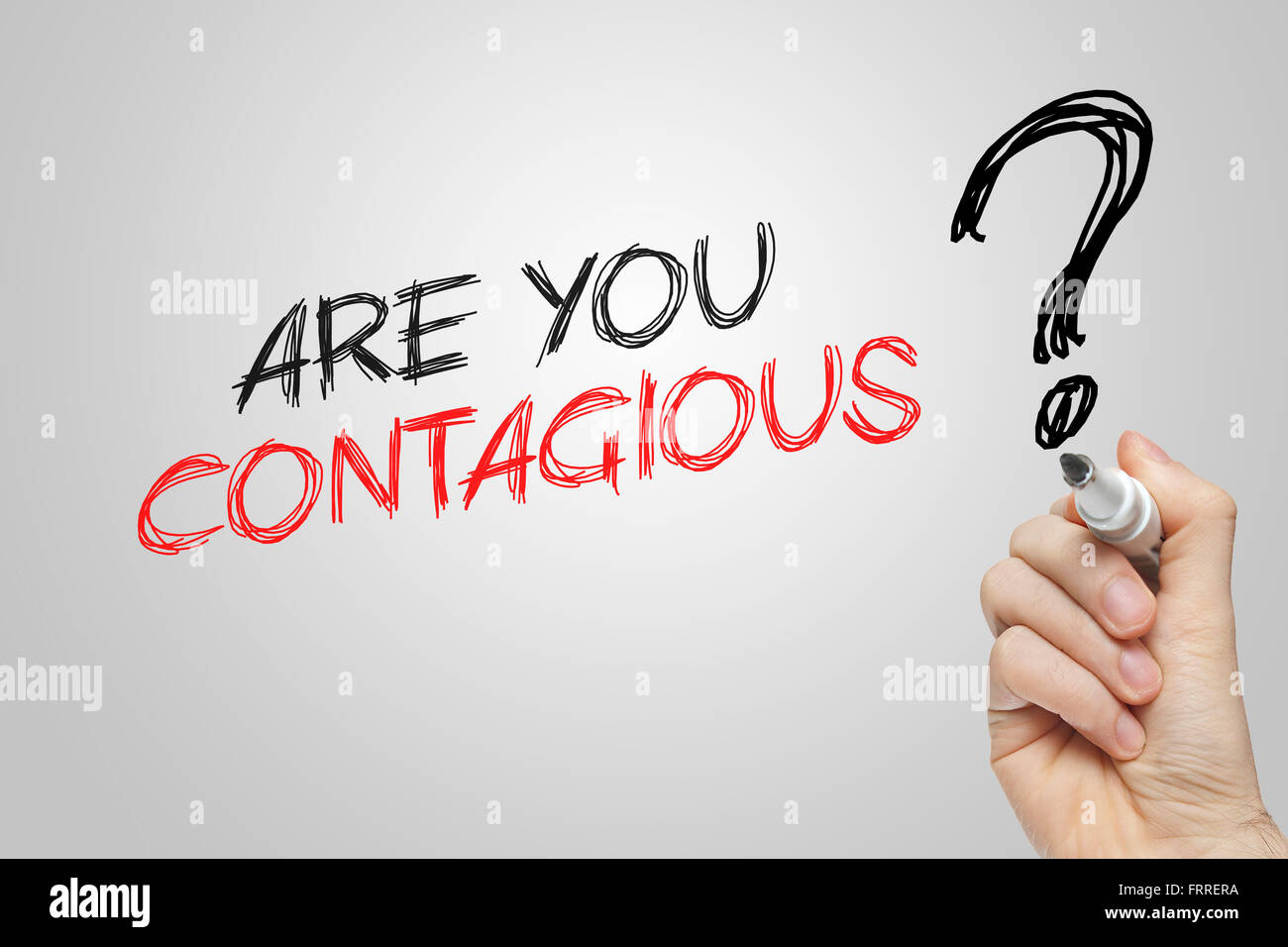 Hand writing are you contagious on grey background Stock Photo