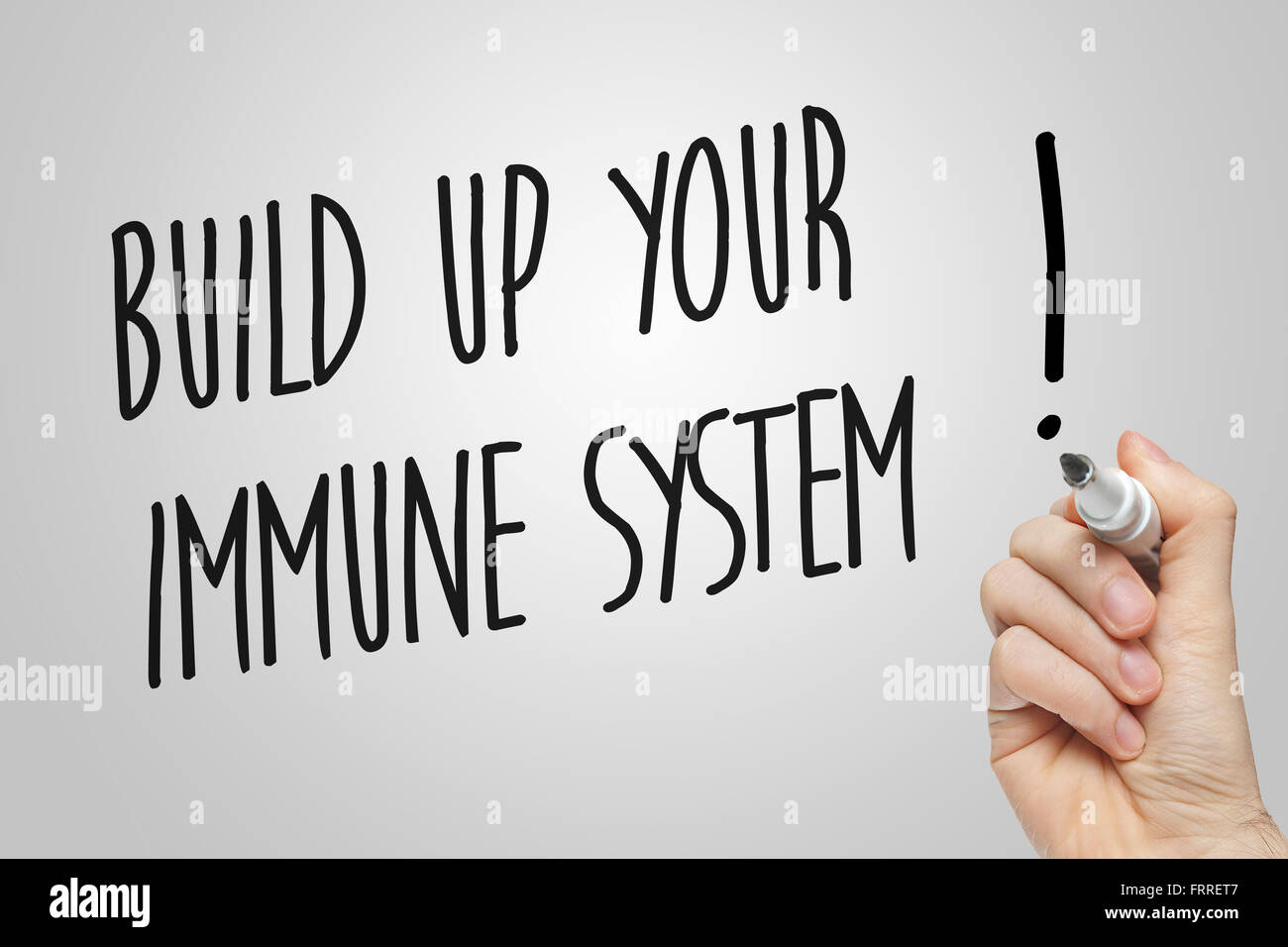 Hand writing build up your immune system on grey background Stock Photo