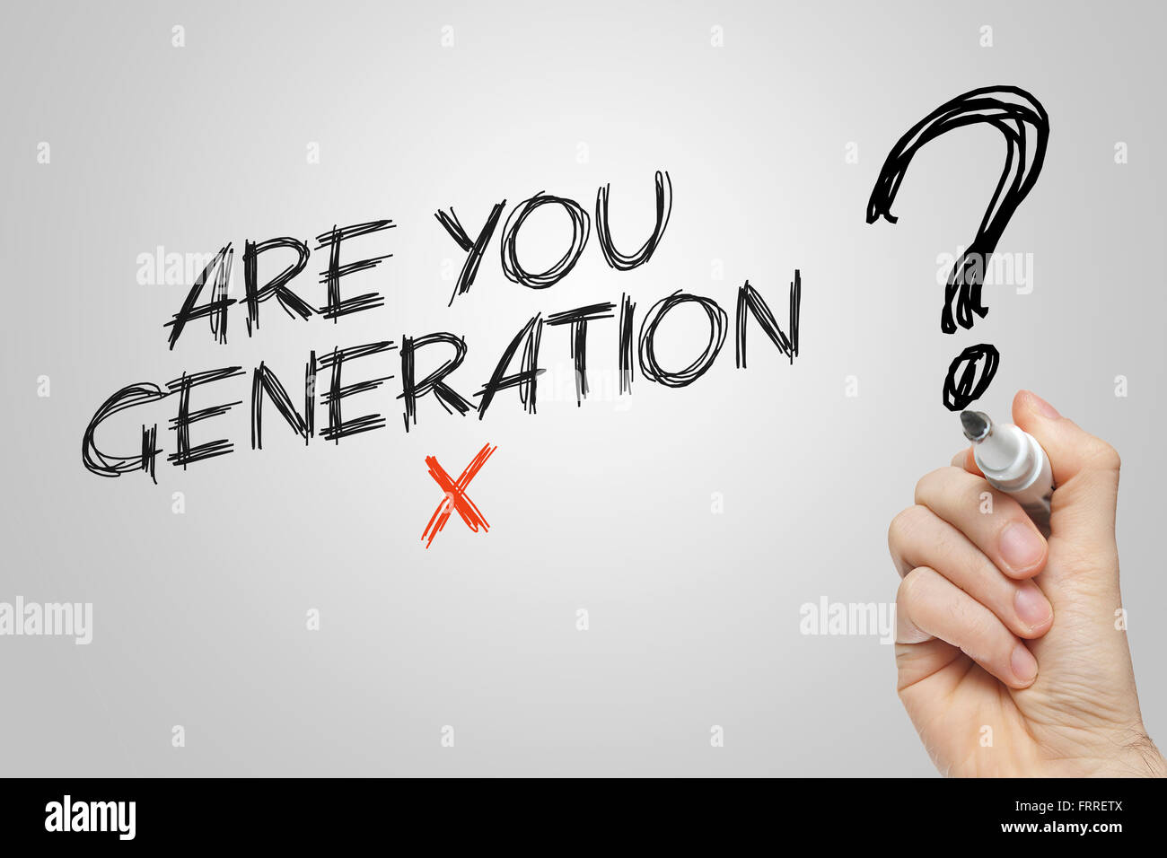 Hand writing are you generation x on grey background Stock Photo