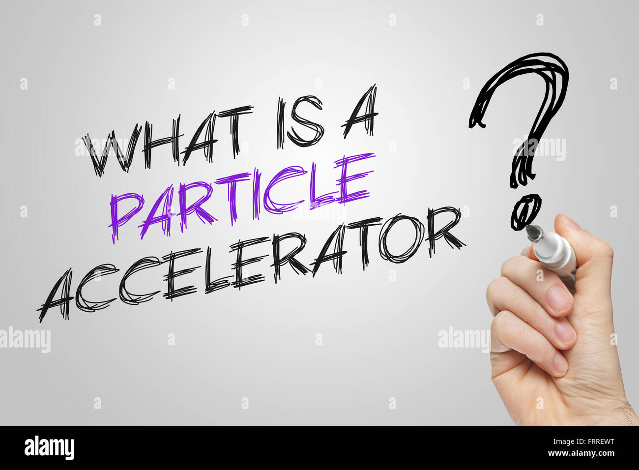 Hand writing what is a particle accelerator on grey background Stock ...
