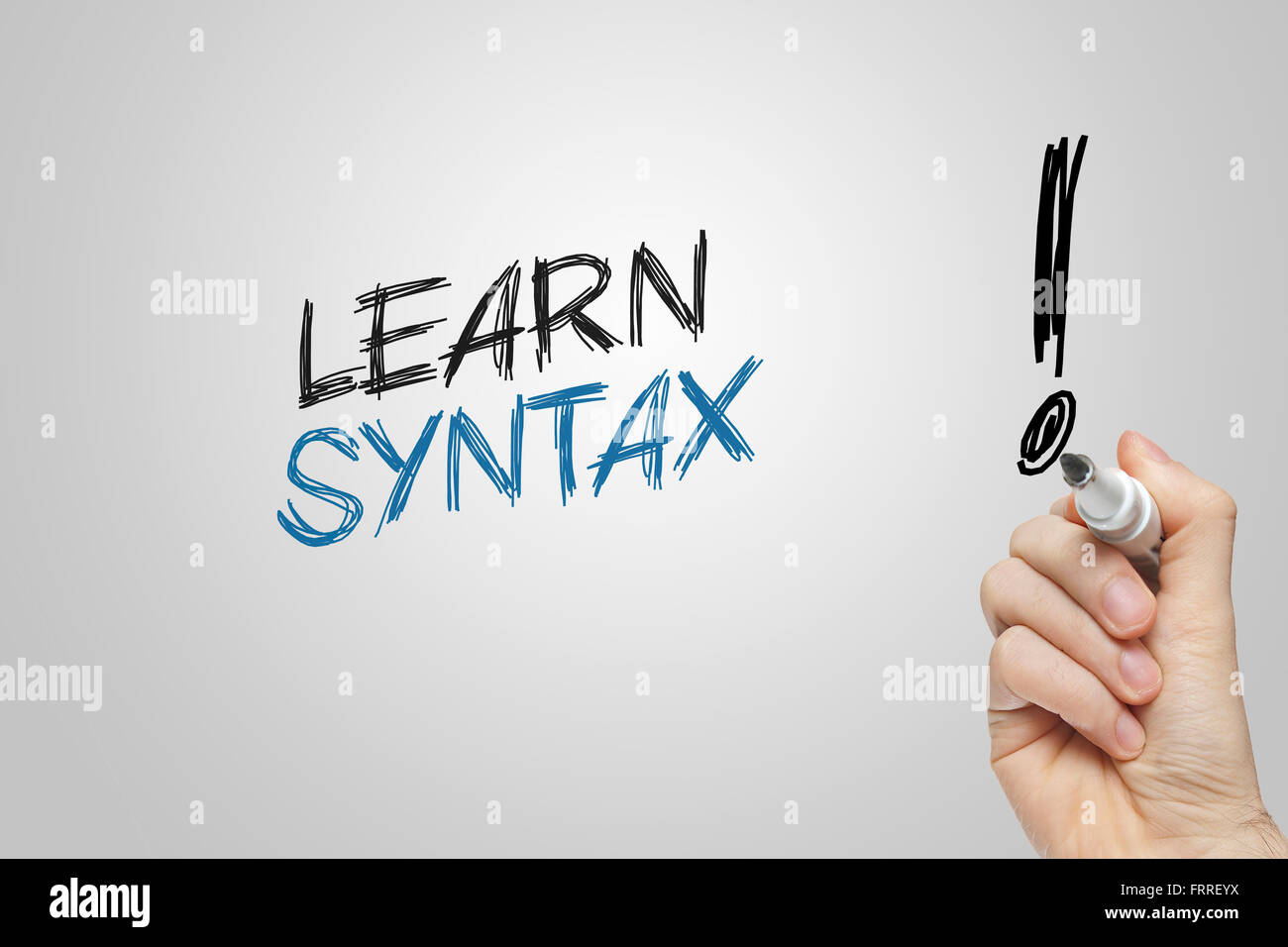 Hand writing learn syntax on grey background Stock Photo
