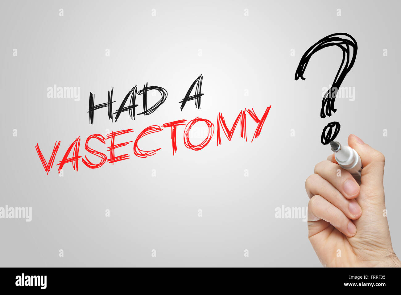 Hand writing had a vasectomy on grey background Stock Photo