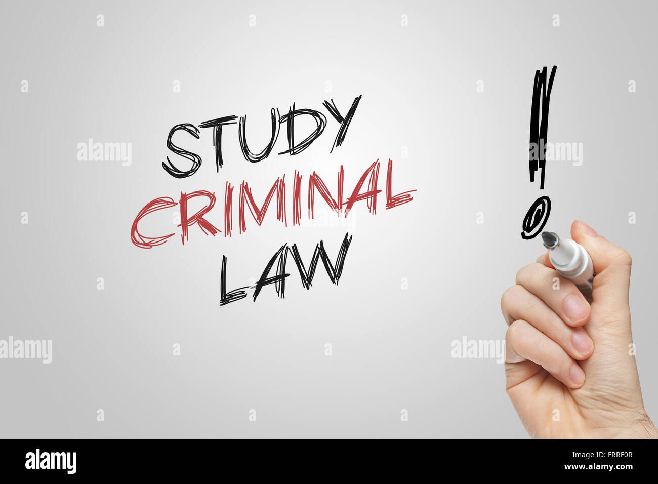 Hand writing study criminal law on grey background Stock Photo