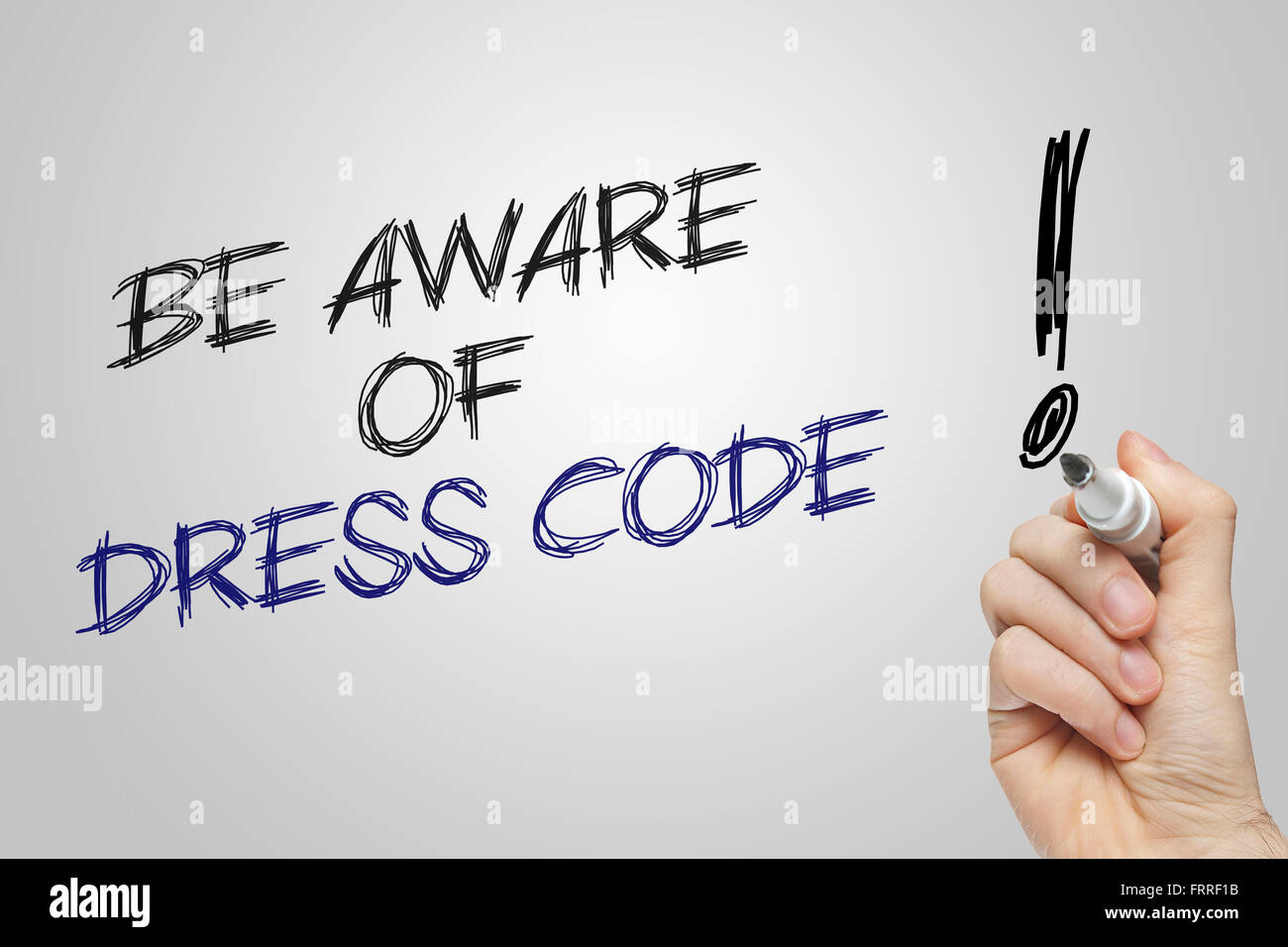 Hand writing be aware of dress code on grey background Stock Photo