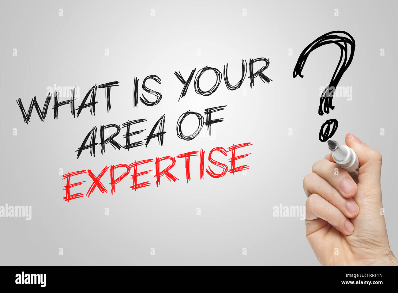 Hand writing what is your area of expertise on grey background Stock Photo