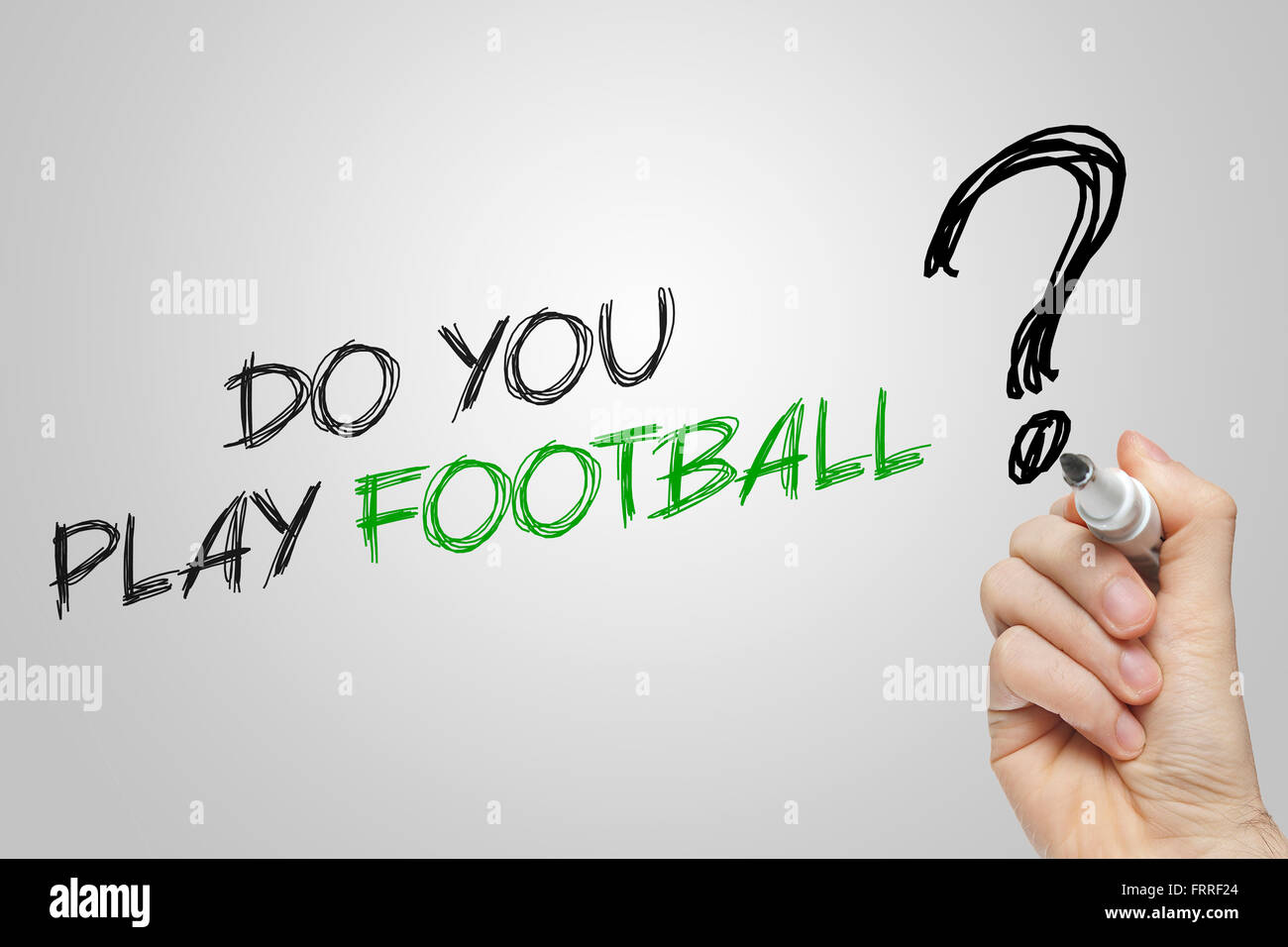 Hand writing do you play football on grey background Stock Photo - Alamy