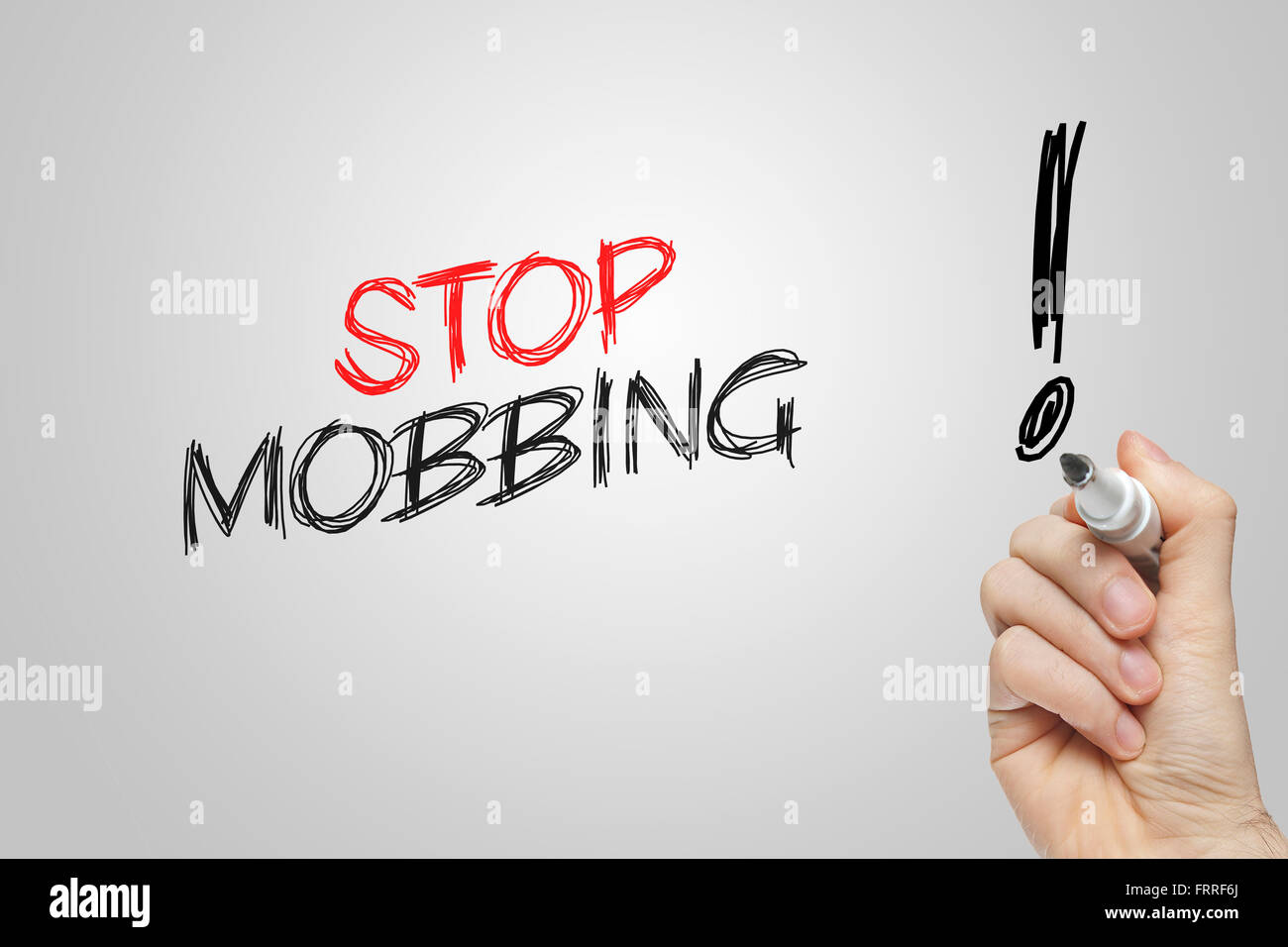 Hand writing stop mobbing on grey background Stock Photo