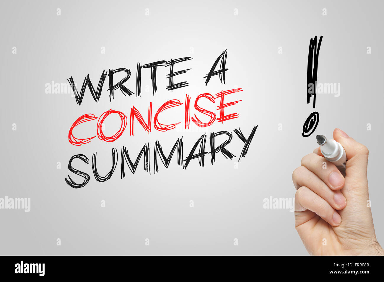 Hand writing write a concise summary on grey background Stock Photo