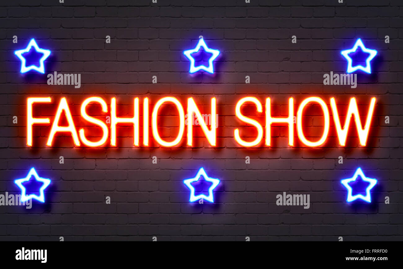 Fashion show neon sign on brick wall background Stock Photo - Alamy