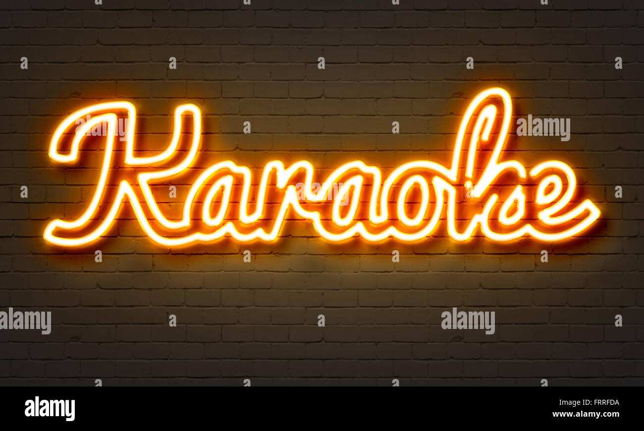 Karaoke neon sign on brick wall background Stock Photo - Alamy