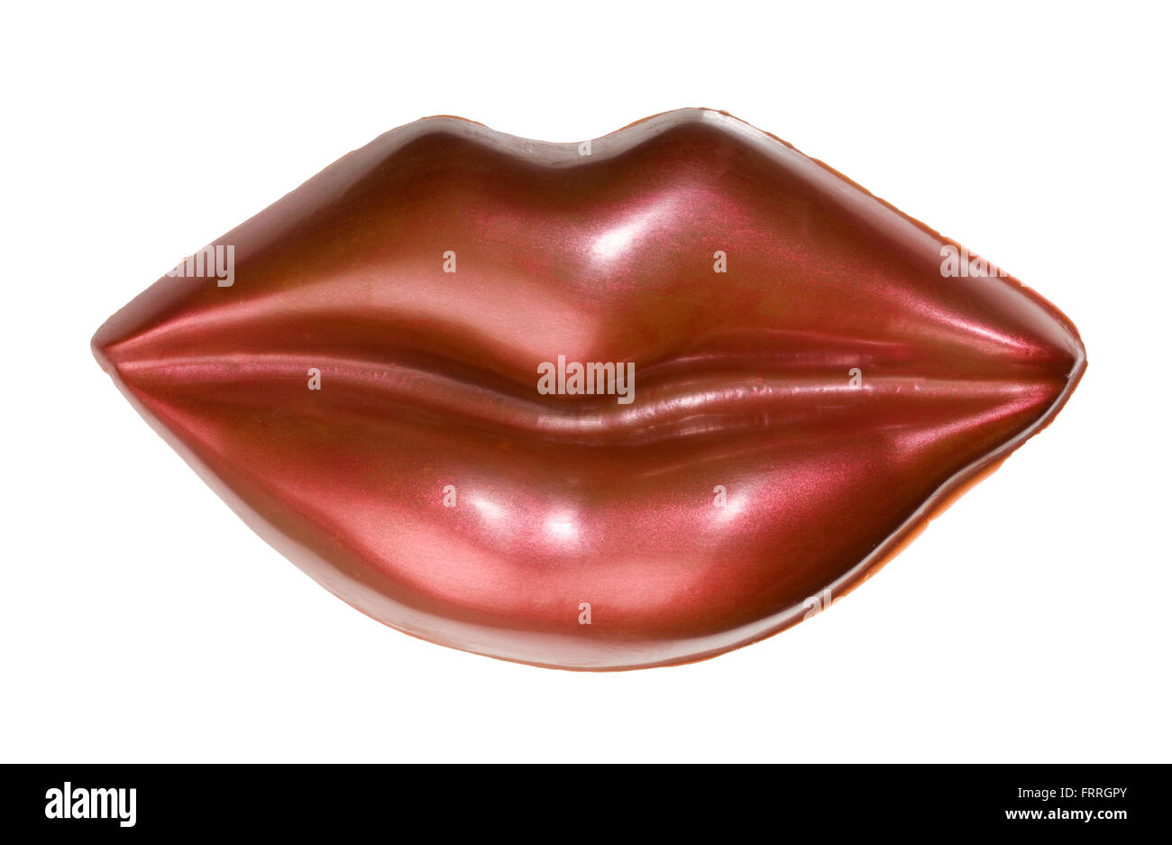 chocolate lips. Red shiny lips made from decorated milk chocolate. Moulded chocolate gift item. Stock Photo