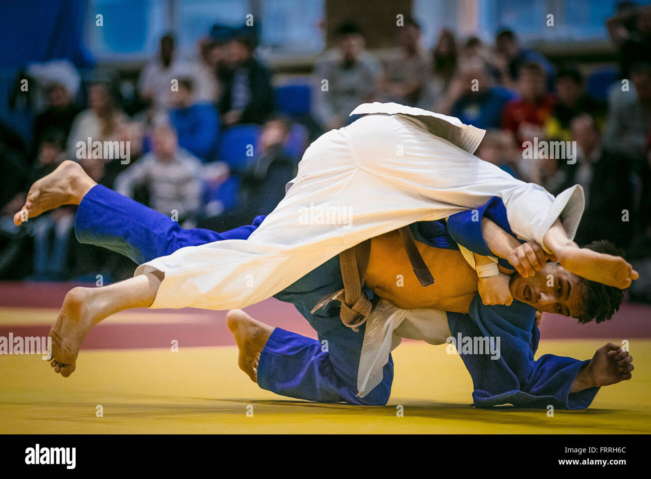 wrestling duel between athlete men judokas on tatami during AllRussian